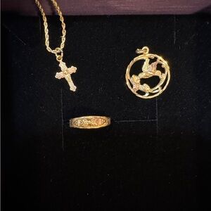 Black Hills Gold cross and hummingbird pendants, and pinky ring (or child ring).